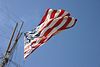 Andrew > The Stars and Stripes mounted on an historic ship at the San Francisco Maritime Park