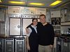 Andrew > Hanging out in the aft galley - Michelle and I posing amongst trolleys full of tasty Economy fare