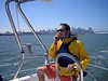 Andrew > Commodore Collins skillfully handles the helm and his cellphone