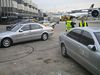 Andrew > The gaggle of Mercedes S klasse automobiles delivering First Class passengers from the F Terminal.

The Porsche Cayenne that delivered me is hiding in the back left.

The drivers are in the yellow safety vests.
